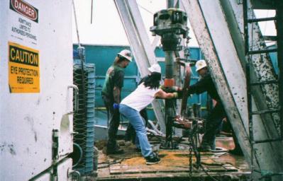 Rig workers near Evanston, about 1980. Uinta County Museum.