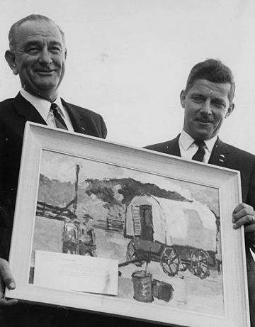 Campaigning together in Casper in 1964, President Lyndon Johnson and Wyoming's U.S. Senator Gale McGee admire a painting of a sheep wagon--a testament to the sheep industry's staying power in Wyoming politics.