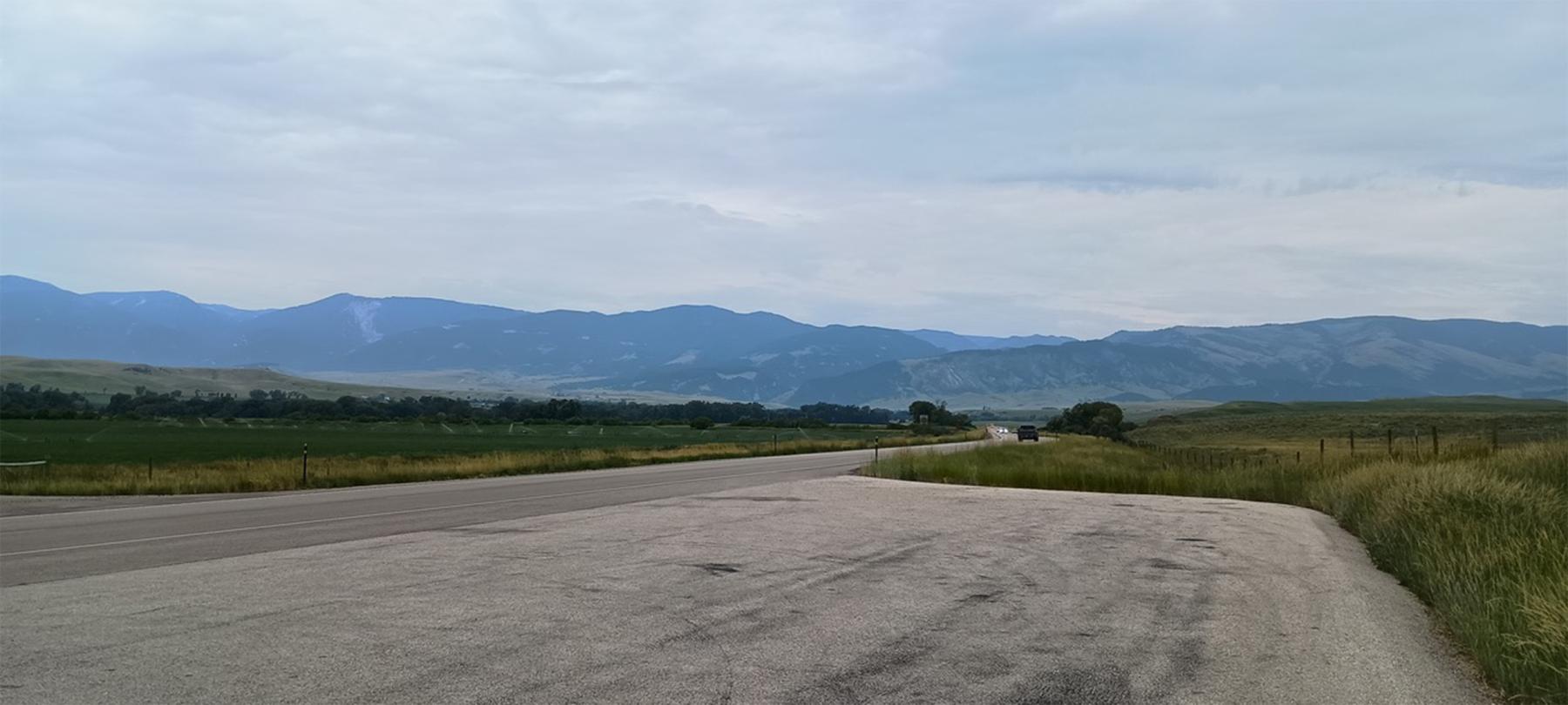 Looking west toward the Bighorn Mountains from a spot between Ranchester and Dayton, Wyoming, near where the Bozeman Trail crossed the Tongue River. Seeking vengeance for Gen. Patrick Connor’s attack on their nearby village just days earlier, Arapaho warriors attacked the Sawyers Expedition near here. Both sides ended up negotiating while awaiting word from General Connor. During the interim, the civilians in the expedition threatened mutiny if James Sawyers remained in charge. Author photo.