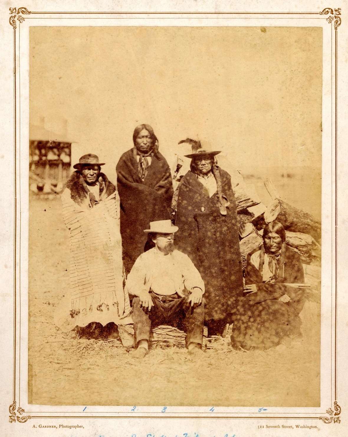 Fur trader Leon Pallardy sits in 1868 in front of the Lakota Sioux men, left to right, Fast Bear, Spotted Tail, John and Long Hair. Eight years earlier the census documented Pallardy living in civilian quarters next to Fort Laramie. Photo by Alexander Gardner. British Museum. Fur trader Leon Pallardy sits in 1868 in front of the Lakota Sioux men, left to right, Fast Bear, Spotted Tail, John and Long Hair. Eight years earlier the census documented Pallardy living in civilian quarters next to Fort Laramie. Photo by Alexander Gardner. British Museum.