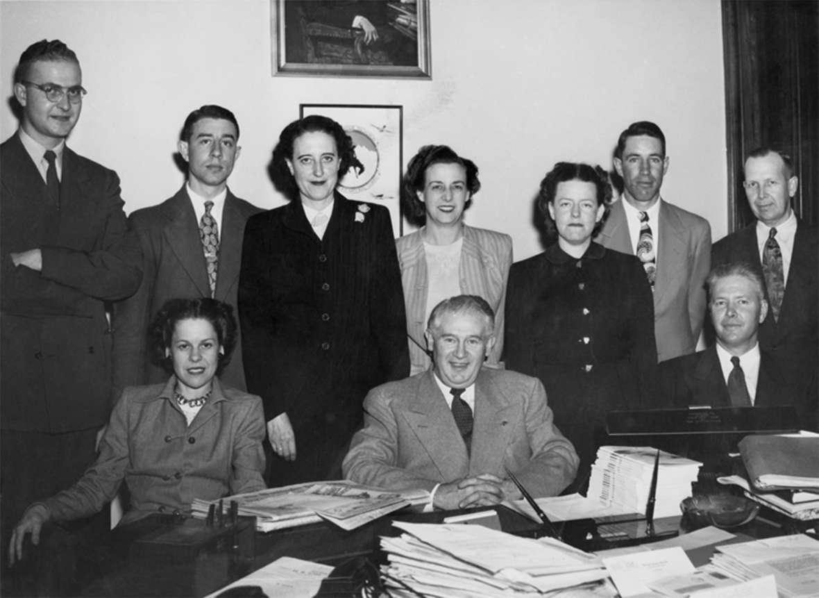 U.S. Senator Hunt around 1950 with his staff. Seated: left to right Gertrude Johnson, Hunt. Back row: Frank Bowron, Zan Lewis, Betty Phelan, Mary McGrath, Mildred Naylor, “Stub” Farlow, and Al Harris. The man seated at far right is unidentified. Wyoming State Archives. U.S. Senator Hunt around 1950 with his staff. Seated: left to right Gertrude Johnson, Hunt. Back row: Frank Bowron, Zan Lewis, Betty Phelan, Mary McGrath, Mildred Naylor, “Stub” Farlow, and Al Harris. The man seated at far right is unidentified. Wyoming State Archives.