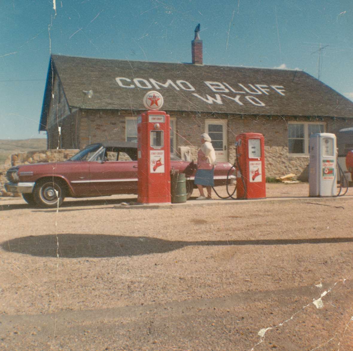 At Como Bluff east of Medicine Bow, the Boylan family in the 1930s built the famed 'fossil cabin' out of pieces of dinosaur bone and other fossils, together with this more conventional house. The roadside attraction and Texaco station continued operating into the 1970s—but after 1970, when Interstate 80 was completed, business would have contracted severely. Wyoming State Archives. At Como Bluff east of Medicine Bow, the Boylan family in the 1930s built the famed 'fossil cabin' out of pieces of dinosaur bone and other fossils, together with this more conventional house. The roadside attraction and Texaco station continued operating into the 1970s—but after 1970, when Interstate 80 was completed, business would have contracted severely. Wyoming State Archives.