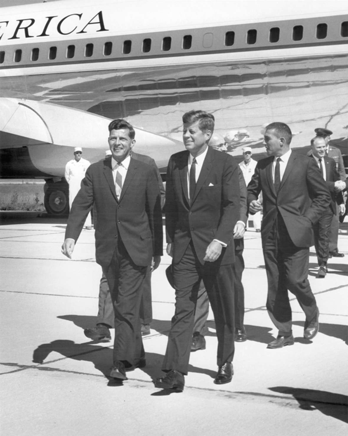 Gale McGee, left, was still in his first Senate term when President Kennedy, center, stopped at the Cheyenne airport in October 1963. Behind the president is Interior Secretary Stewart Udall; behind him, shaking hands, is Cheyenne Mayor Bill Nation. Wyoming State Archives. Gale McGee, left, was still in his first Senate term when President Kennedy, center, stopped at the Cheyenne airport in October 1963. Behind the president is Interior Secretary Stewart Udall; behind him, shaking hands, is Cheyenne Mayor Bill Nation. Wyoming State Archives.