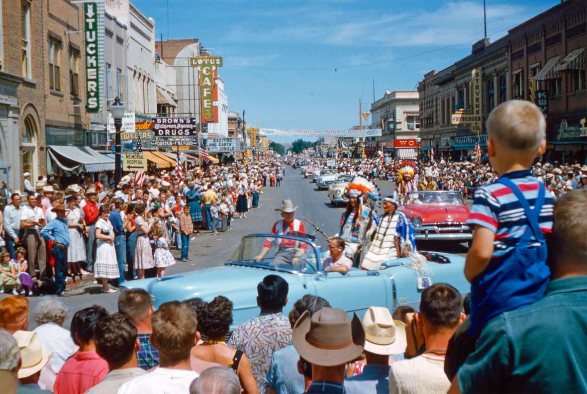 Spectators thronged the third annual All-American Indian Days parade in 1955, enjoying the floats, admiring Indian horses and regalia, and celebrating tribal veterans and the reigning Miss Indian America. Here, All American Indian Day founder Howard Sinclair rides in a convertible with honored Sioux guests. Courtesy David Eppen. Spectators thronged the third annual All-American Indian Days parade in 1955, enjoying the floats, admiring Indian horses and regalia, and celebrating tribal veterans and the reigning Miss Indian America. Here, All American Indian Day founder Howard Sinclair rides in a convertible with honored Sioux guests. Courtesy David Eppen.