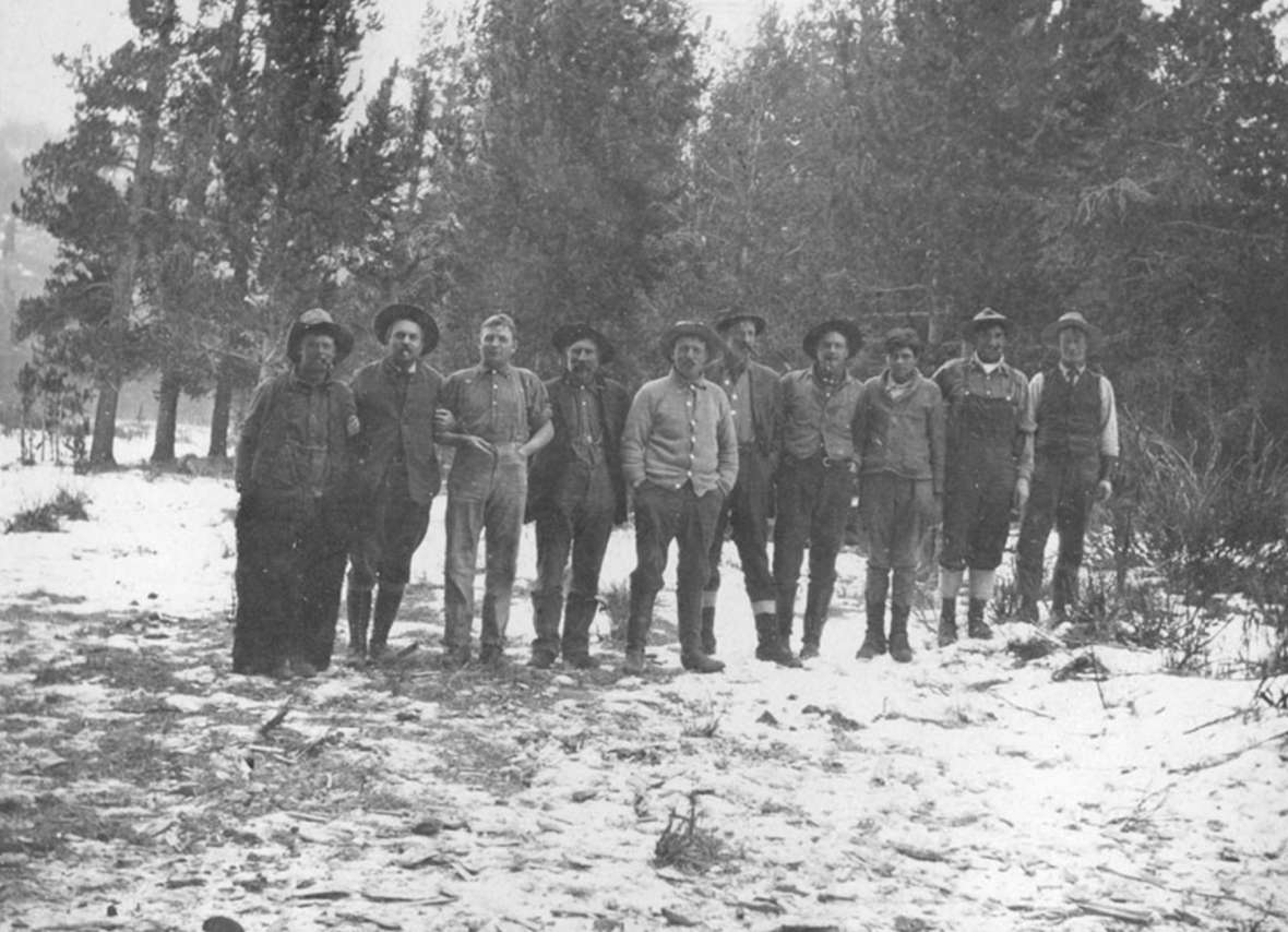 Charles Gates, second from left, with all the guides, horse wranglers, cooks, and camp attendants on the trip guided by Ned Frost, fall 1913. Park County Archives. Charles Gates, second from left, with all the guides, horse wranglers, cooks, and camp attendants on the trip guided by Ned Frost, fall 1913. Park County Archives.