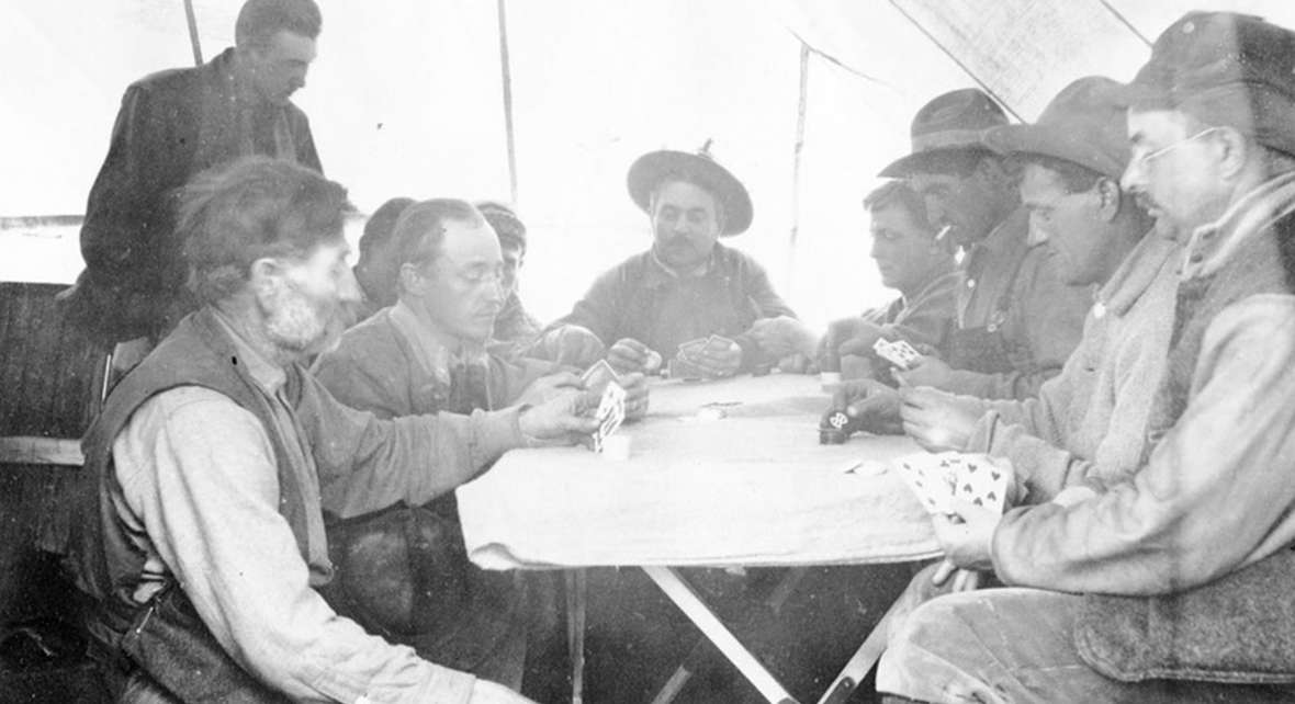 In hunting camp, Charles Gates—at the head of the table—and his posse played poker as if they were the finest casinos. Park County Archives. In hunting camp, Charles Gates—at the head of the table—and his posse played poker as if they were the finest casinos. Park County Archives.