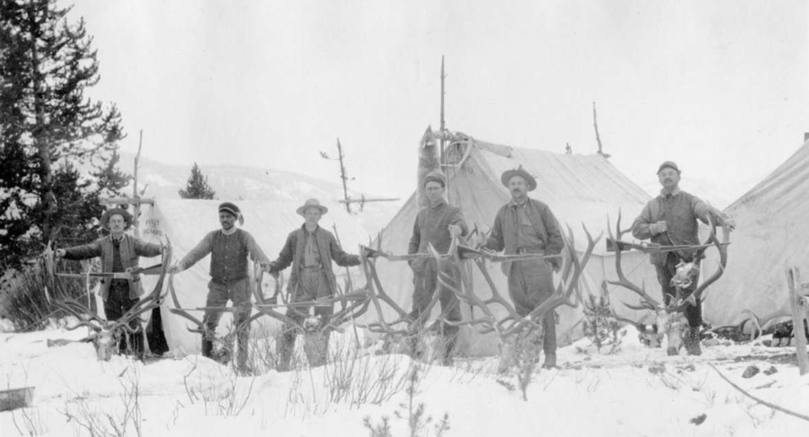 Charles Gates, second from right, and other hunters with their trophies during their 1913 trip. Altogether they bagged 10 bull elk and three mule deer in their month in the wilderness. Park County Archives. Charles Gates, second from right, and other hunters with their trophies during their 1913 trip. Altogether they bagged 10 bull elk and three mule deer in their month in the wilderness. Park County Archives.