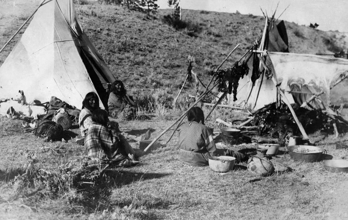 The White River Utes camped in late October 1906 on Powder River a short distance north of the Montana-Wyoming line. This view of one lodge and its residents also shows deer meat drying on a rack. T.W. Tolman photo, Campbell County Rockpile Museum. The White River Utes camped in late October 1906 on Powder River a short distance north of the Montana-Wyoming line. This view of one lodge and its residents also shows deer meat drying on a rack. T.W. Tolman photo, Campbell County Rockpile Museum.