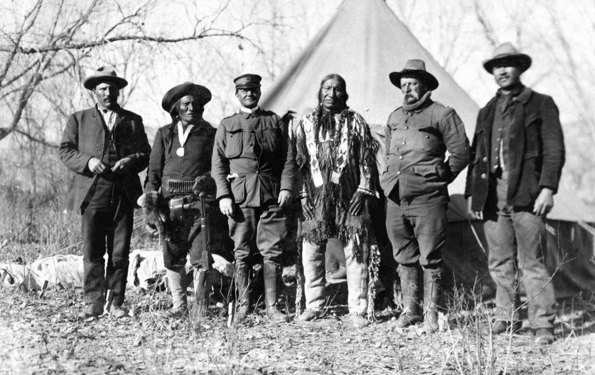 Negotiators for the government at the Big Talk on Powder River, November 1906. Left to right, interpreter Peter Shangreau; Lakota Sioux elder Woman’s Dress; Maj. Grierson, Sixth Cavalry; Lakota elder American Horse; Capt. Carter P. Johnson, 10th Cavalry; interpreter Frank Goings. The Utes came to trust Johnson more than any of the other white men they dealt withT.W. Tolman photo, Campbell County Rockpile Museum. Negotiators for the government at the Big Talk on Powder River, November 1906. Left to right, interpreter Peter Shangreau; Lakota Sioux elder Woman’s Dress; Maj. Grierson, Sixth Cavalry; Lakota elder American Horse; Capt. Carter P. Johnson, 10th Cavalry; interpreter Frank Goings. The Utes came to trust Johnson more than any of the other white men they dealt withT.W. Tolman photo, Campbell County Rockpile Museum.
