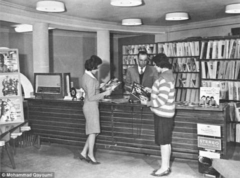 Above, Afghan women browse in a record store, 1960s; below, women students in a biology lab at Kabul University. These photos were remarkable at the time for showing women in western clothing and in the same room as men who were not members of their family. The images are from a photobook published by the Afghan planning ministry in the l1960s and republished by Mohammed Qayoumi in a 2010 photo essay in Foreign Policy magazine. Qayoumi grew up in Kabul in the 1950s and ‘60s. American Heritage Center, University of Wyoming. Above, Afghan women browse in a record store, 1960s; below, women students in a biology lab at Kabul University. These photos were remarkable at the time for showing women in western clothing and in the same room as men who were not members of their family. The images are from a photobook published by the Afghan planning ministry in the l1960s and republished by Mohammed Qayoumi in a 2010 photo essay in Foreign Policy magazine. Qayoumi grew up in Kabul in the 1950s and ‘60s. American Heritage Center, University of Wyoming.
