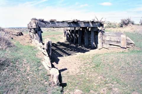 Remains of a wood timber bridge were found in 2002 along the earliest route of the Black and Yellow Trail, near present-day State Route 113 in Keyhole State Park before it was rerouted to the north in the late 1910s—so that tourists could more easily visit Devil’s Tower. Authors photo, 2002. Remains of a wood timber bridge were found in 2002 along the earliest route of the Black and Yellow Trail, near present-day State Route 113 in Keyhole State Park before it was rerouted to the north in the late 1910s—so that tourists could more easily visit Devil’s Tower. Authors photo, 2002.