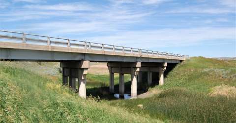 This single-span wide flange steel girder bridge crosses Rawhide Creek north of Gillette on U.S. Route 14-16. It was built in 1941, when the Black and Yellow Trail was reconstructed in this area. Authors photo, 2017. This single-span wide flange steel girder bridge crosses Rawhide Creek north of Gillette on U.S. Route 14-16. It was built in 1941, when the Black and Yellow Trail was reconstructed in this area. Authors photo, 2017.